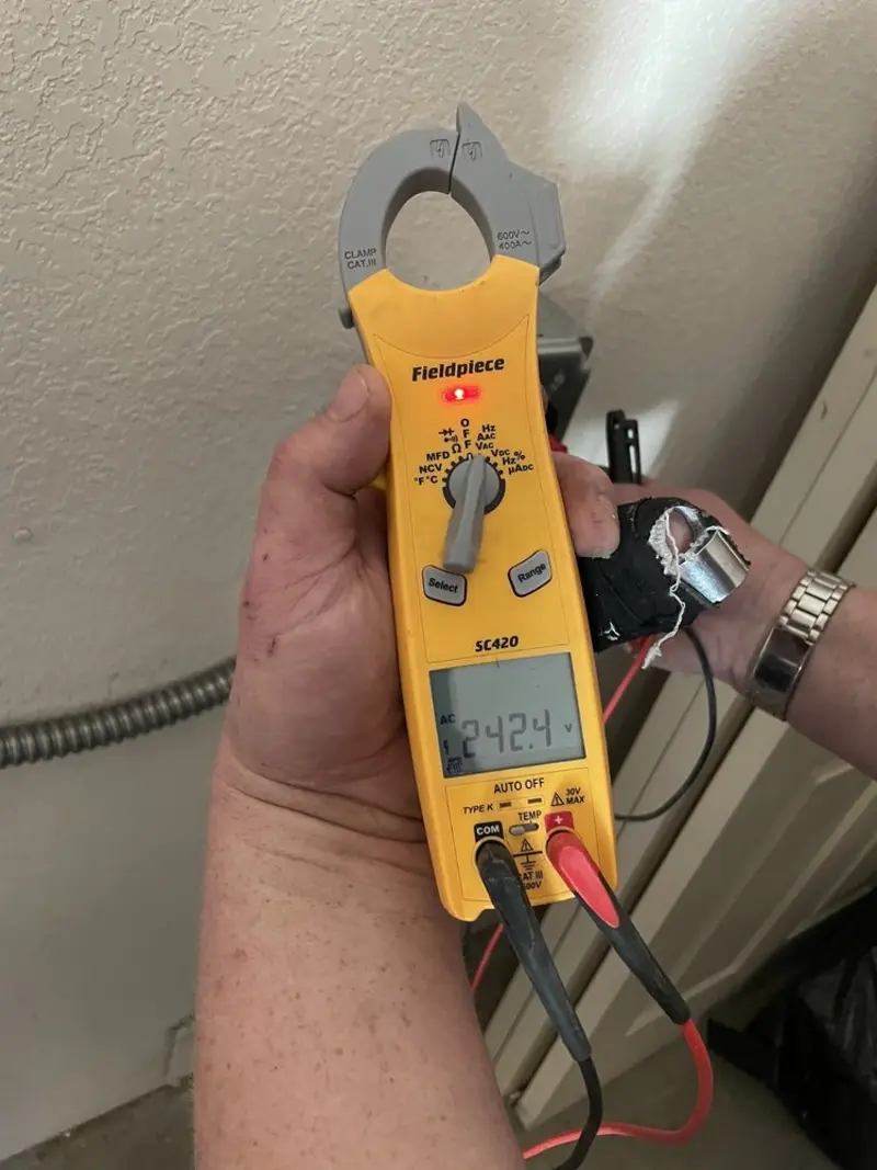 Voltage testing with clamp meter during Outlet Installation in Santa Clara
